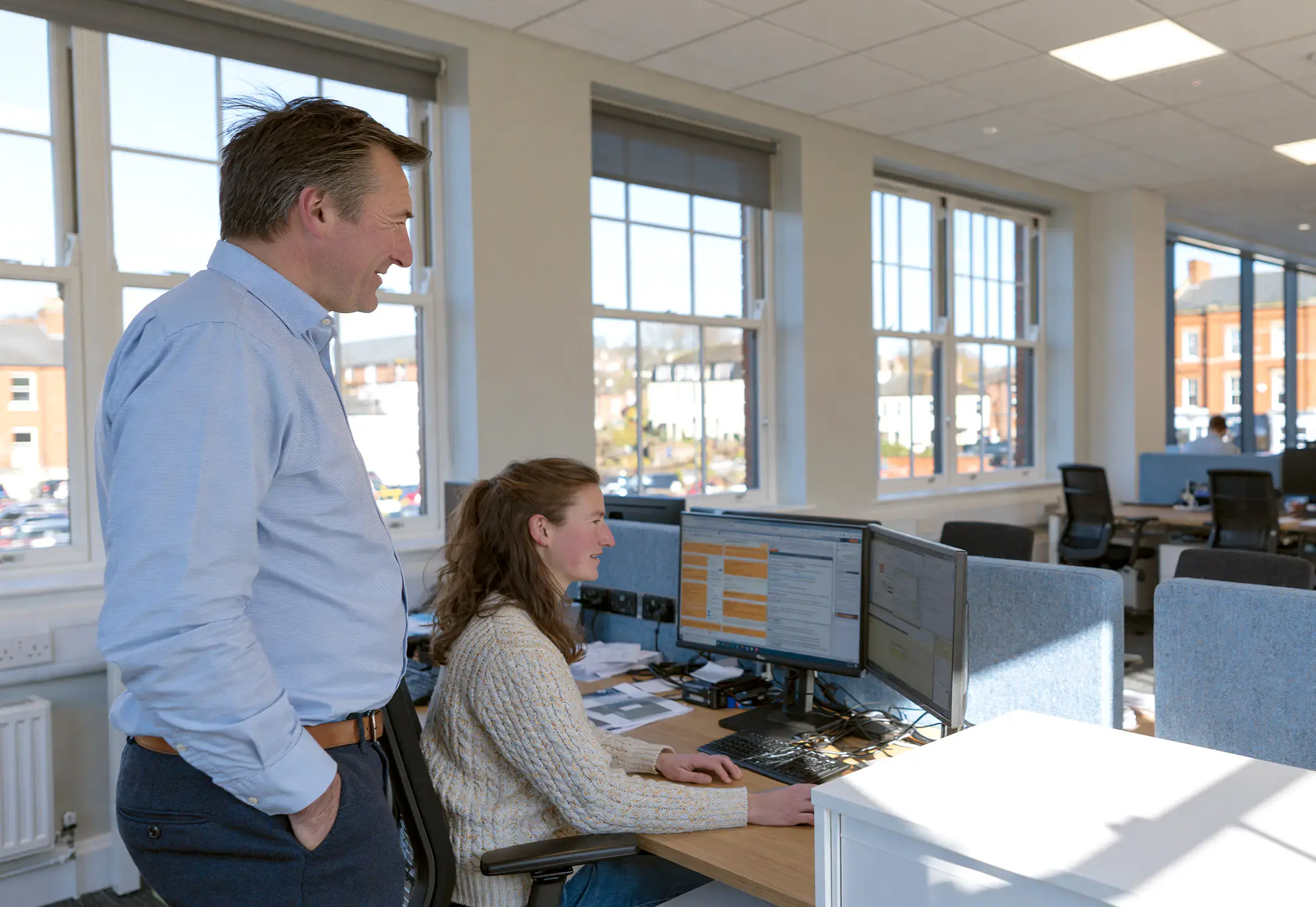 A data protection officer reviewing a request with a colleague